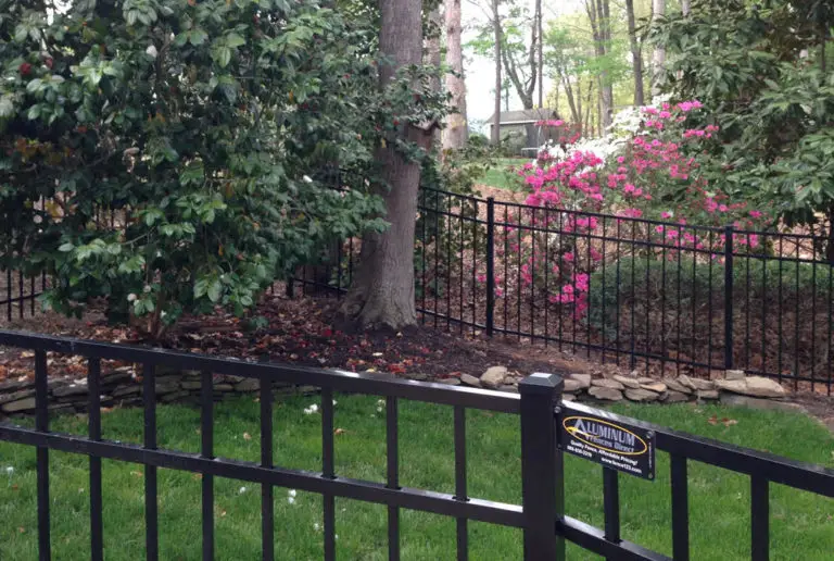 Aluminum fence surrounding a garden